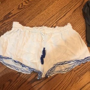 White shorts with blue embroidery